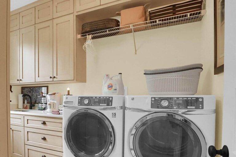 Laundry folding area storage cabinetry
