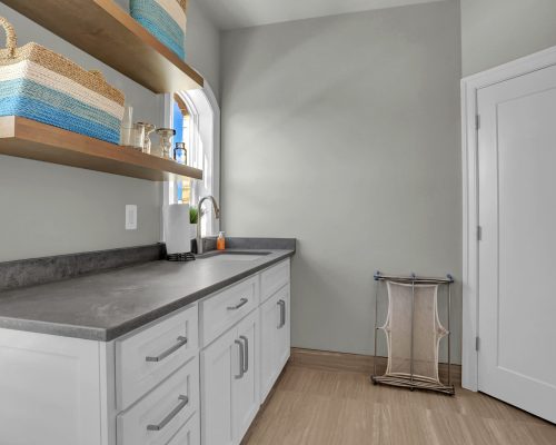 Laundry Room with Floating Shelves